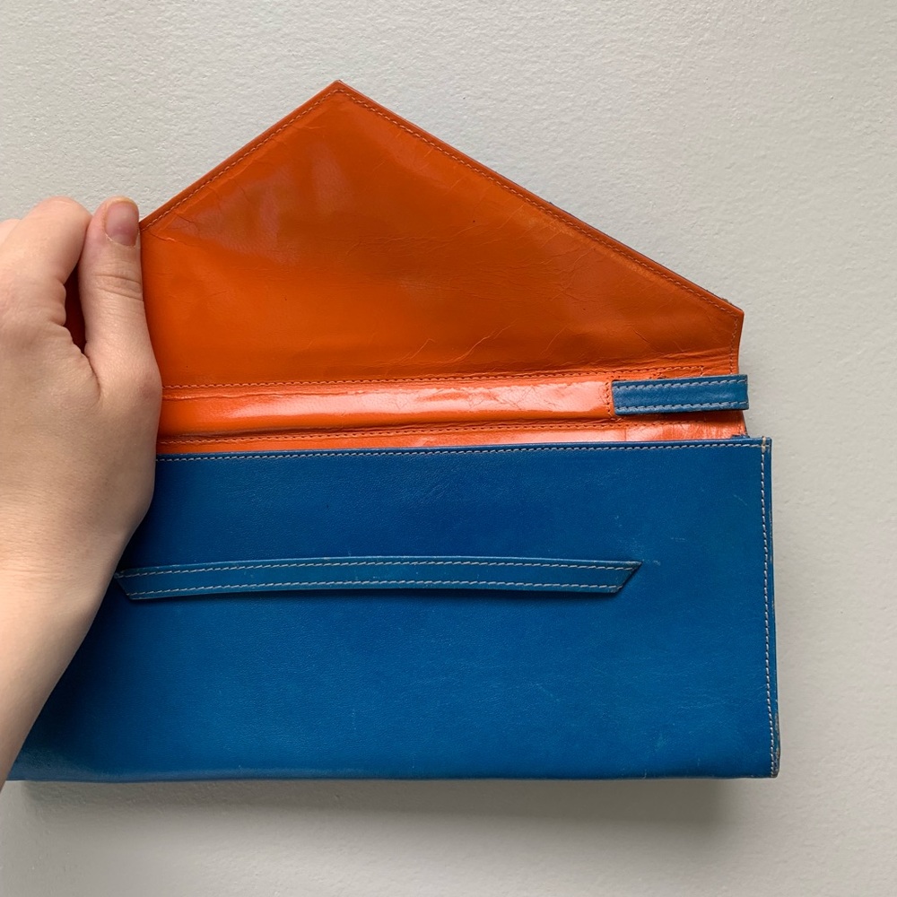 Tusk LTD. blue and orange envelop clutch